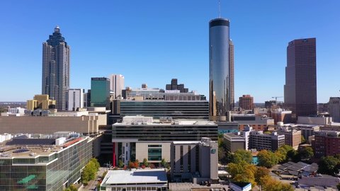 ATLANTA, GEORGIA - CIRCA 2020s - Rising aerial of downtown Atlanta Georgia with skyscrapers and high rises.