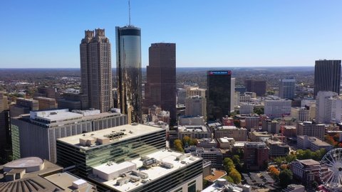 ATLANTA, GEORGIA - CIRCA 2020s - Good establishing aerial of downtown business district Atlanta Georgia includes Westin Hotel.