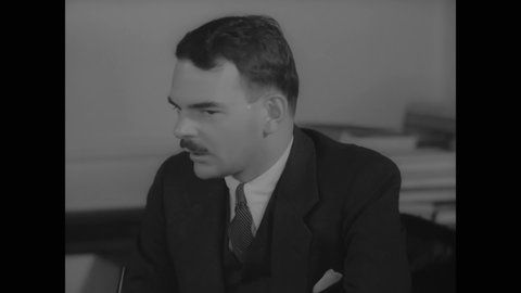 CIRCA 1937 - Thomas Dewey meets with his chief assistants in the deputy district attorney's office.