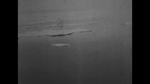 CIRCA 1925 - Excellent aerial view of ice floes diverging off the coast of Greenland.