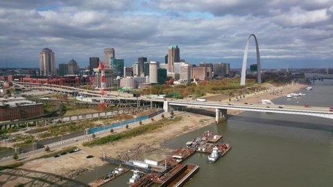 ST. LOUIS MISSOURI - CIRCA 2020s - Good aerial over downtown St. Louis, the Gateway Arch and Mississippi River.