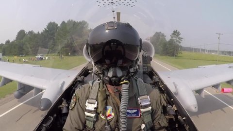 CIRCA 2020s - Cockpit footage of Fairchild Republic A-10 Thunderbolt II Warthog close support fighter jet pilot taxiing on a Michigan roadway.
