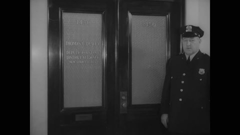 CIRCA 1937 - Police guard deputy district attorney Thomas Dewey's office.