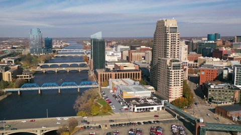 GRAND RAPIDS, MICHIGAN - CIRCA 2020s - Good aerial over Grand Rapids, Michigan downtown, river and city skyline.