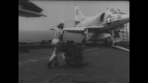 CIRCA 1966 - US Navy planes take off from aircraft carriers to bomb North Vietnam, and Secretary McNamara explains why the air raids are necessary.