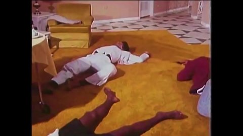 CIRCA 1977 - In this Blaxploitation movie, a PI threatens a thug at gunpoint to say who sent him.