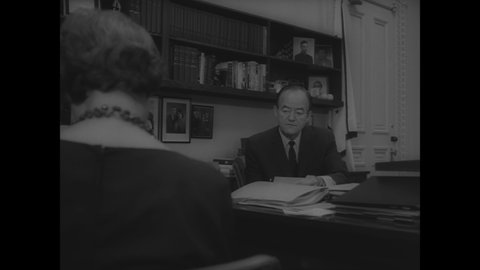CIRCA 1966 - Vice President Humphrey takes care of paperwork in his office, then attends the FBI Academy's graduation ceremony with J. Edgar Hoover.
