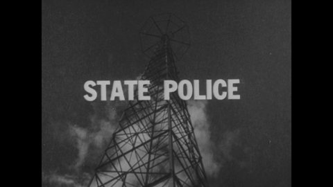 CIRCA 1936 - Policemen use the latest in radio dispatch technology in Michigan.