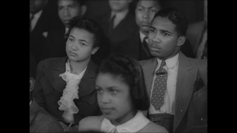 CIRCA 1939 - African-American students take notes during a lecture at Dillard University.