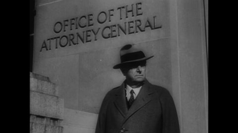 CIRCA 1936 - Attorney General Cummings steps out of his office in Washington DC, and a plaque at FBI headquarters honors fallen agents.