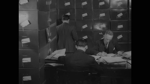 CIRCA 1937 - Clerks in Thomas Dewey's office do filing work.