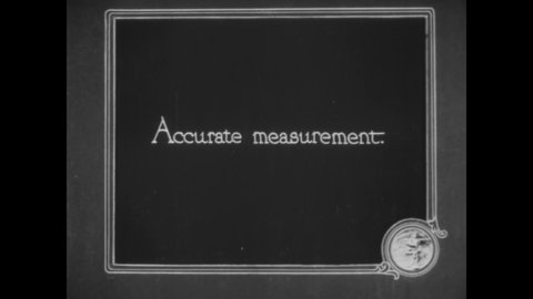 CIRCA 1919 - Nurses measure a woman's baby.