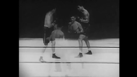 CIRCA 1937 - Joe Louis defeats Jim Braddock in a boxing match at Comiskey Park.