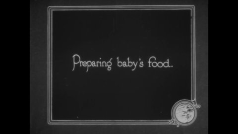 CIRCA 1919 - A nurse teaches girls how to prepare baby food.