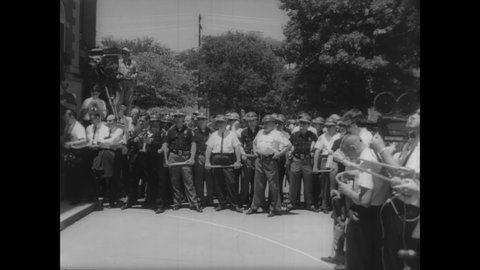 CIRCA 1963 - Governor George Wallace stands at the gates of Alabama University to meet federal officers to force the university to integrate.