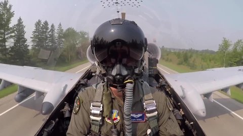 CIRCA 2020s - Cockpit footage Fairchild Republic A-10 Thunderbolt II Warthog close support fighter jet pilot taking off from Michigan roadway.