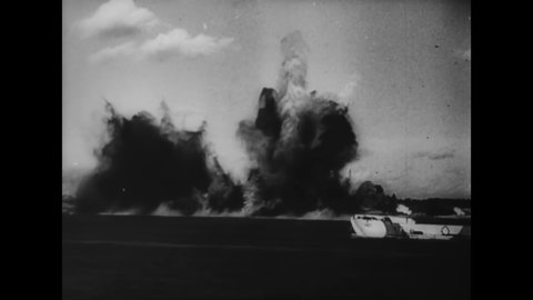 CIRCA 1944 - Allied soldiers fire rocket guns and artillery from invasion barges on D-Day.