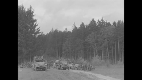 CIRCA 1945 - M-7 motor carriages, armored cars, and half tracks of the 14th Armored Division are driven towards the Danube.