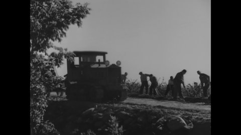 CIRCA 1936 - Secondary roads are built and repaired by the WPA in upstate New York, helping farmers a great deal.