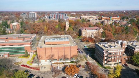 EAST LANSING, MICHIGAN - CIRCA 2020s - Aerial over Michigan State University college campus.
