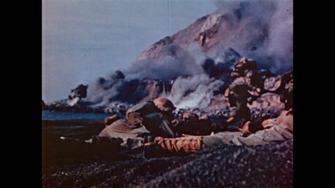 CIRCA 1945 - Landing crafts bring US Marines to the smoky shores of Iwo Jima.