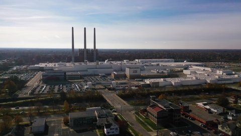 LANSING, MICHIGAN - CIRCA 2020s - Aerial over a lrege automobile manufacturing plant or factory near Lansing, Michigan shows the auto industry.