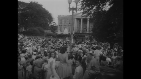 CIRCA 1945 - Crowds swarm outside the White House to hear President Truman declare victory over Japan (narrated in 1963).