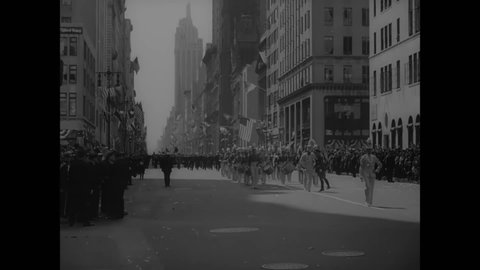 CIRCA 1937 - A US Army band plays and marches in an American Legion parade in New York City.