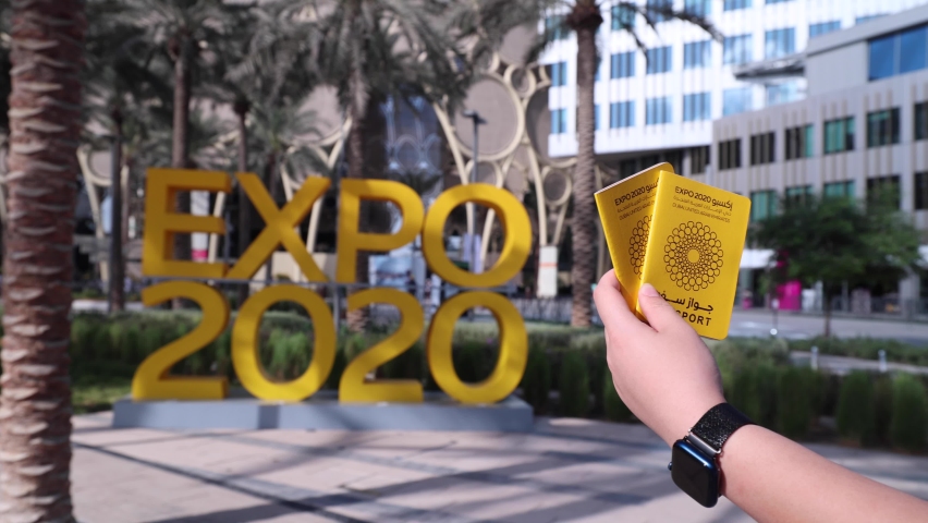 Expo 2020 Name with Expo Passport and Hand. Royalty-Free Stock Footage #1083649201