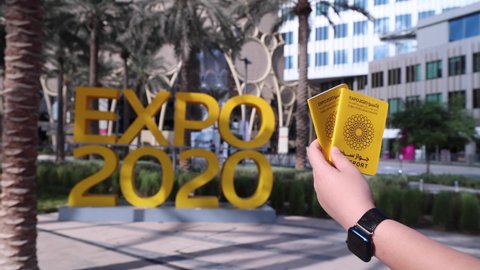 Expo 2020 Name with Expo Passport and Hand.