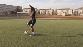 Young black girl training at the city stadium and practicing ball possession technique soccer dribbling - Powered by Shutterstock - Get 15% off with code: PIKWIZARD15