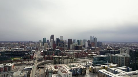 Downtown Denver Colorado Skyline Surrounded By Urban Cityscape. 4K Drone. Camera Flying Forwards.