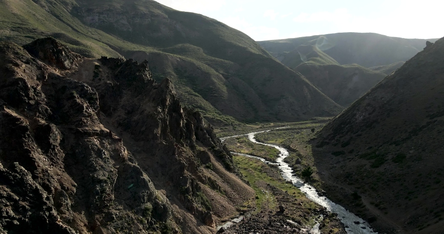 Aerial view of the campanario river with the homonymous hot springs with the sunlight at dawn in the maule region, Chile.