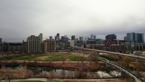 Downtown Denver Colorado Skyline Showing Commons Park Perspective and Surrounding Urban Buildings. 4k Drone.