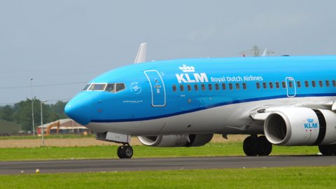 AMSTERDAM, THE NETHERLANDS - JULY 27, 2017: Boeing 737 of KLM braking after landing at Shiphol Airport, Amsterdam (AMS). Tourism and travel concept. KLM planes at the airport, traffic