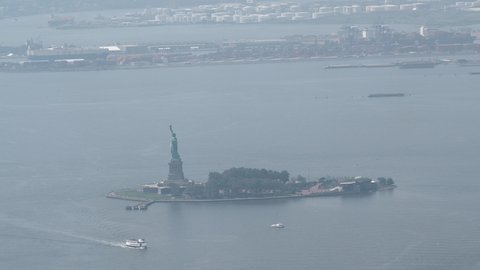 Manhattan, New York City, New York United States - August 29 2021: The Statue of Liberty with boats and helicopters.