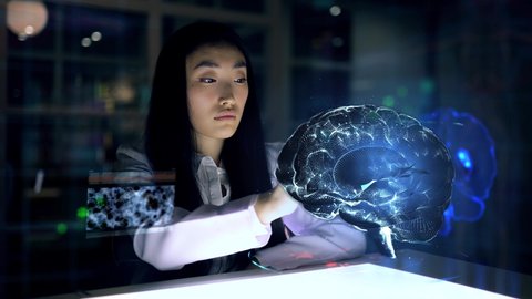 Asian woman Scientist work on 3D Simulated holographic Neural Brain Interface. Engineer using Augmented Holographic Technology. Artificial Intelligence Concept