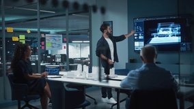 Creative Architect Holds Meeting Presentation of a New Housing Project for a Team of Real Estate Investors. Adult Male Uses TV Screen with Technical Drawings, 3D Renders and Engineering Plans. - Powered by Shutterstock - Get 15% off with code: PIKWIZARD15