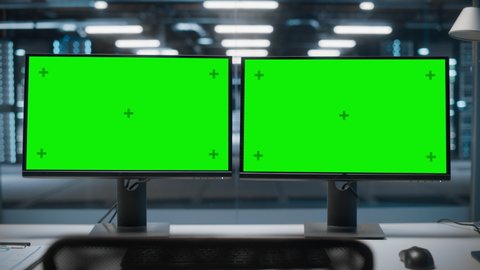 High-Tech Data Center Server with Two Green Screen Chroma Key Display Showing on Personal Computer Standing on a Desk. Concept of Modern Monitoring Web Services, Cloud Computing, Cyber Security