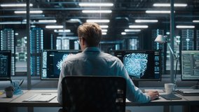 High-Tech Data Center Server Control: IT Specialist Administrator Working on Computer, Screen Advanced Showing Big Data AI Analysis. Web Services, Cloud Computing, Analytics Facility, Cyber Security - Powered by Shutterstock - Get 15% off with code: PIKWIZARD15