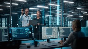 Big Data Center Server Room: Female e-Business Enrepreneur and Male IT Specialist talk, Use Laptop. Information Technology Engineer and System Administrator work on Web Services Cloud Computing SAAS - Powered by Shutterstock - Get 15% off with code: PIKWIZARD15