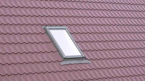 plastic window on the roof of a residential private house