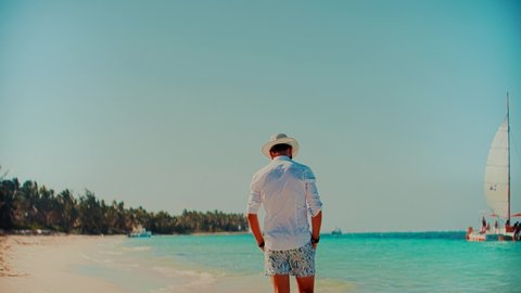 Businessman Relaxation Travel On Beach Vacations. White Sand And Calm Ocean On Seychelles. Caribbean Tropical Idyllic Paradise Island. Travel To Exotic Destination. White Sandy Beach In Dominican 