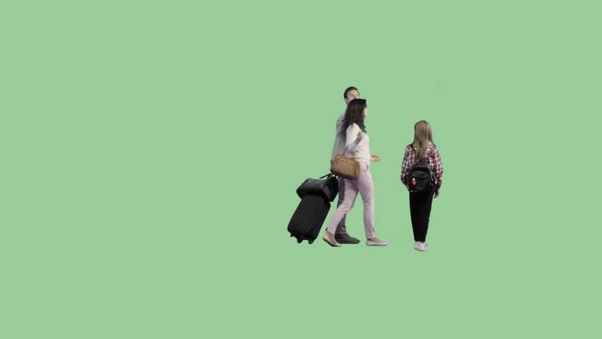 A family with luggage is walking through the terminal. Cut out on a transparent background