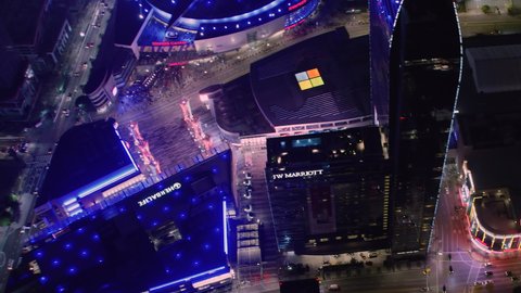 Los Angeles, California. United States. Circa, 2019. Staples Center. Overhead Aerial View of The Multi Purpose Arena in LA. Famous Brands and Logos At Night. The Ritz Carlton, Microsoft, Herbal Life.