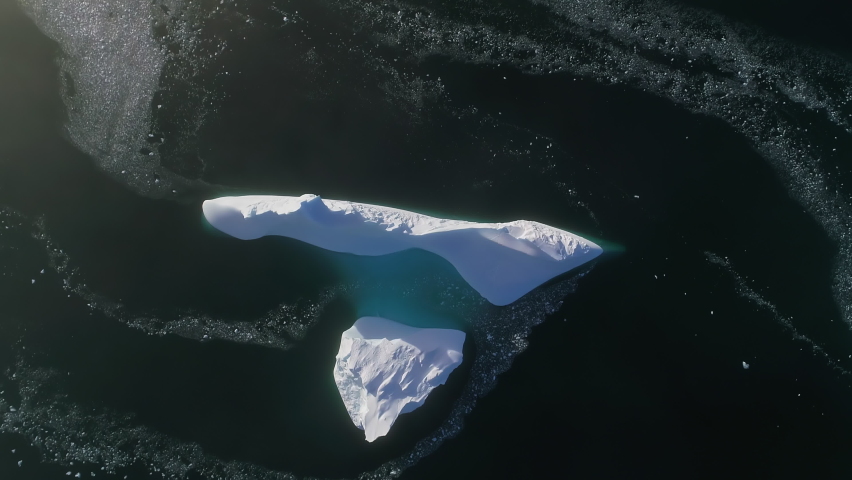 Top down view Antarctic iceberg. Aerial flight. | Shutterstock HD Video #1083701809