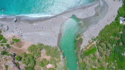 People relax on Preveli beach Crete island Greece aerial view