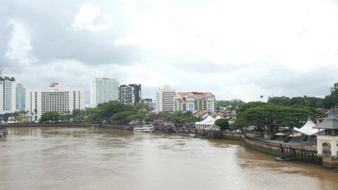 "Kuching, Malaysia-Circa December,2021: A handheld panning footage of Dewan Undangan Negeri Sarawak with the view Kuching City. Sarawak is preparing for State election in this month."