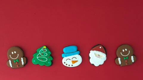 Dancing Christmas Cookies on a Red Background with room for Copy