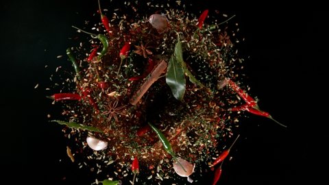 Super Slow Motion Shot of Flying Mix Spices.. Isolated on Black Background. Filmed on high speed cinema camera, 1000fps.